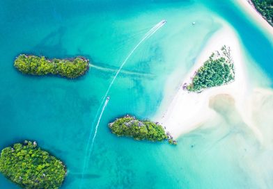 An aerial view of small islands in turquoise water