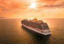 A cruise ship sailing at sunset