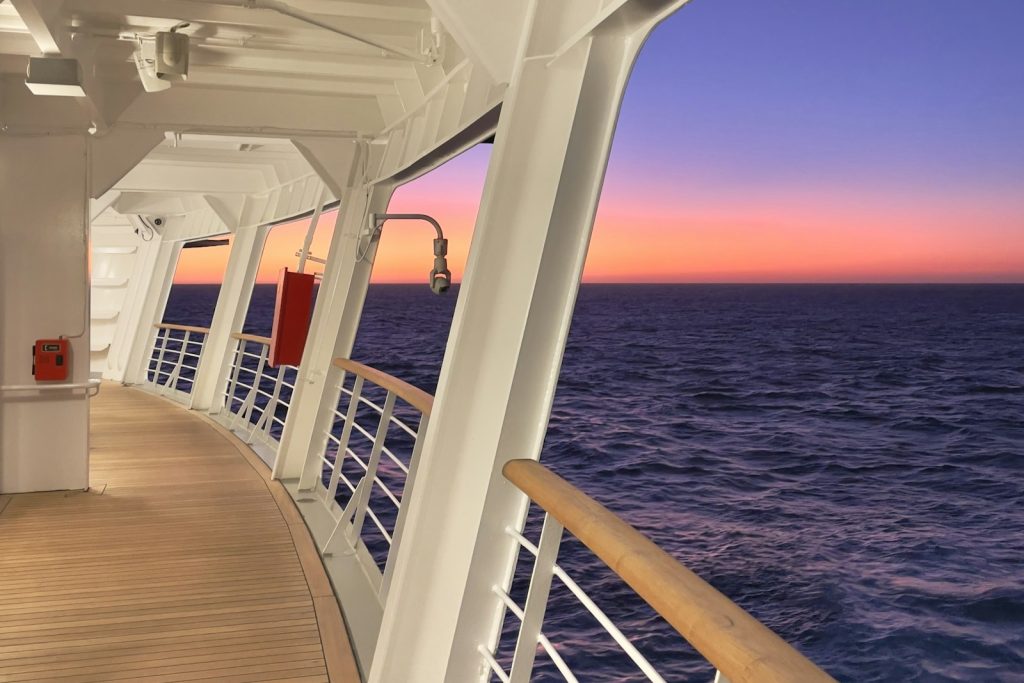 The deck of a cruise ship at sunset